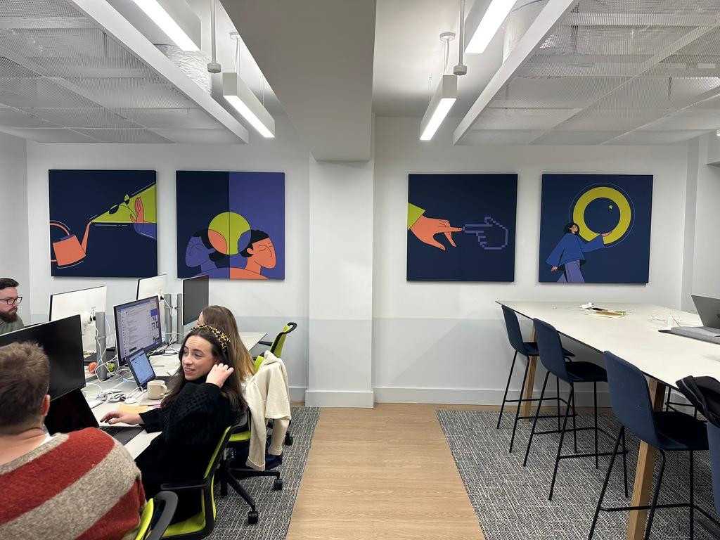 Acoustic custom art wall panels in an office